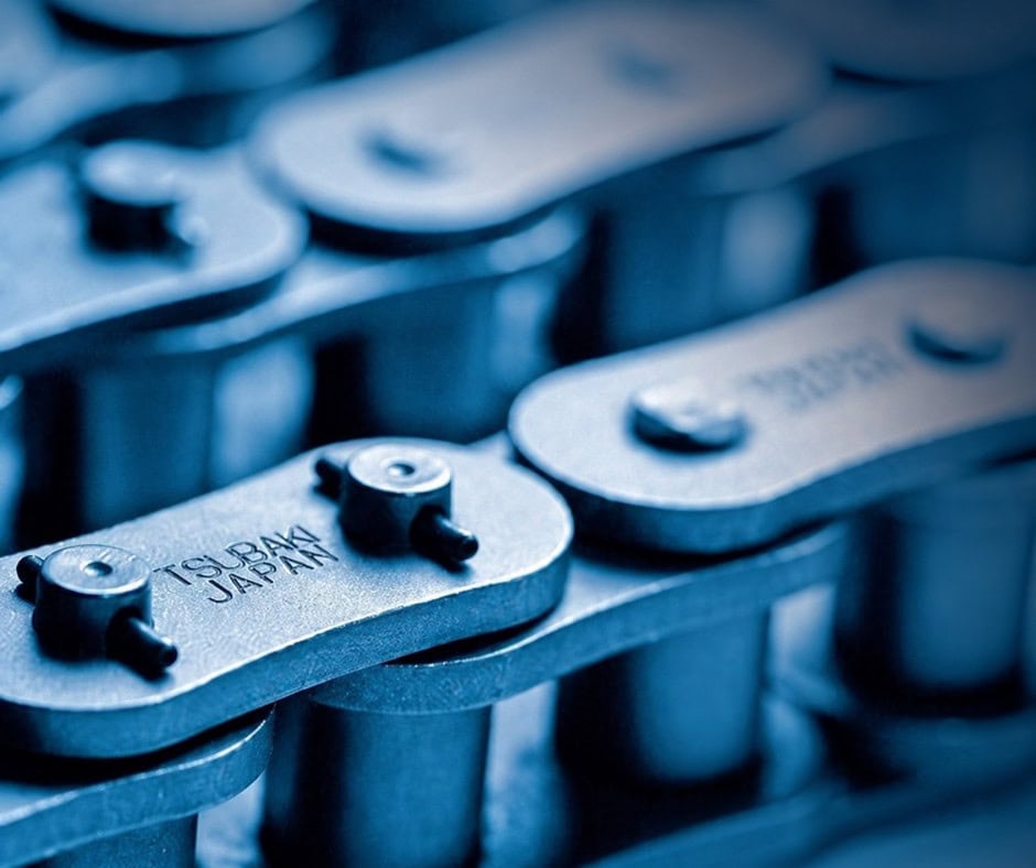 TESS Appointed UK Distributor for Tsubaki Close-up of industrial chain links with Tsubakimoto Japan branding.