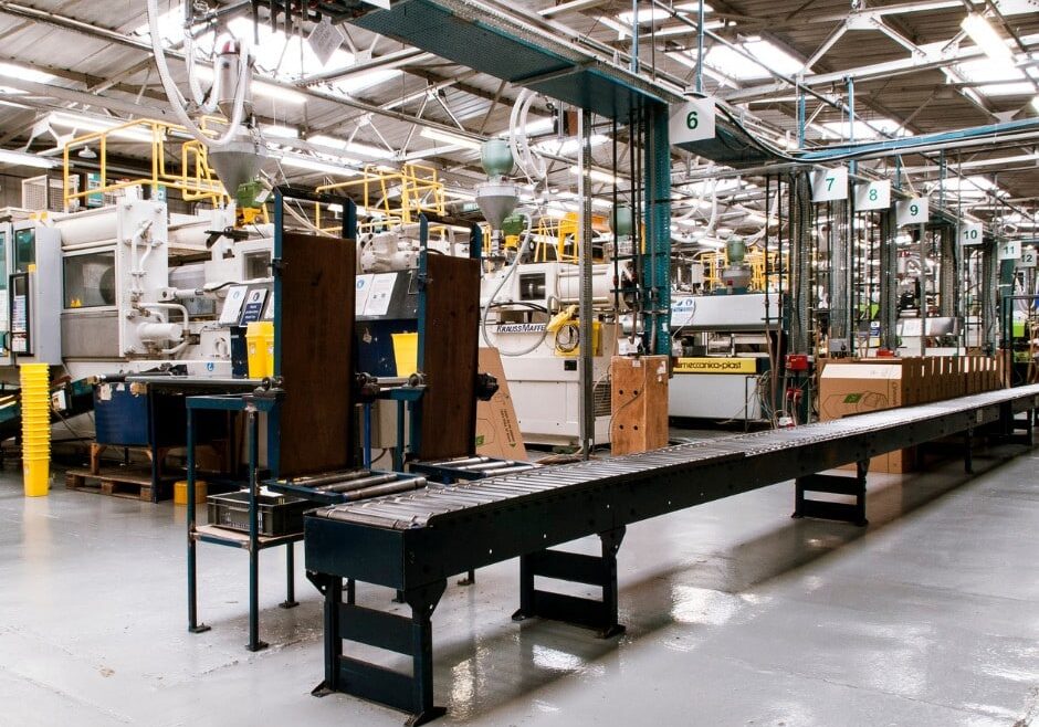 Industrial manufacturing facility with machinery and conveyor belts.